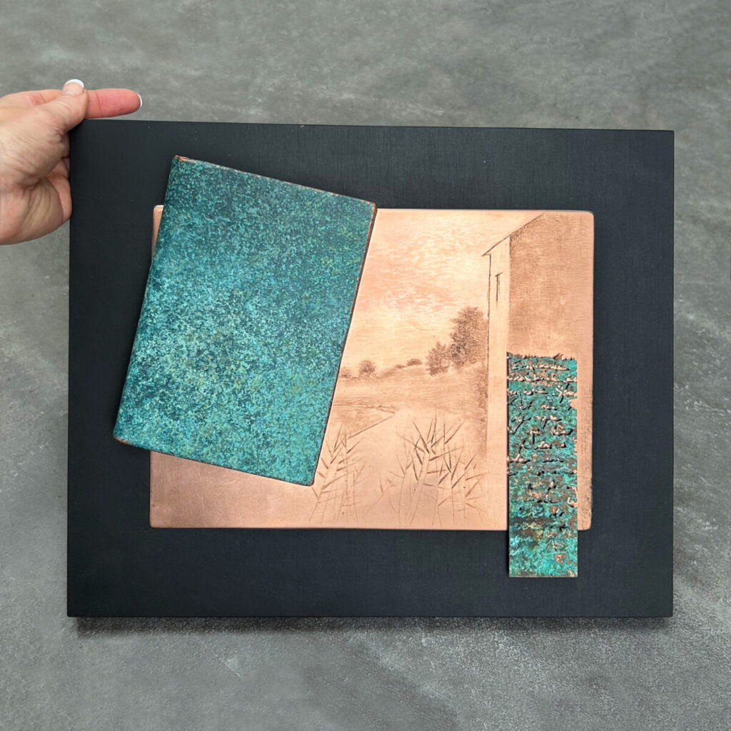 Travel Diary of a Poet held in hand, its copper cover set with a Gunnar Norrman drypoint plate and etched text