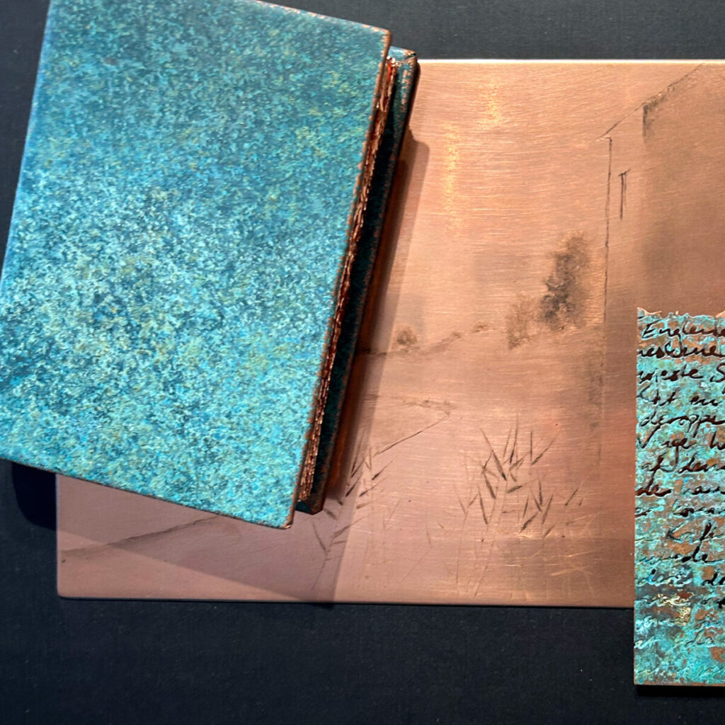 Closeup of Travel Diary of a Poet, the turquoise cover and Gunnar Norrman drypoint plate in view